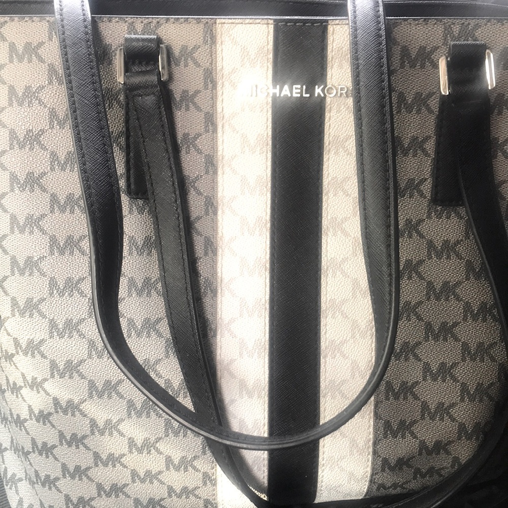 MK never used I’m more of a back pack or shoulder strap purse person